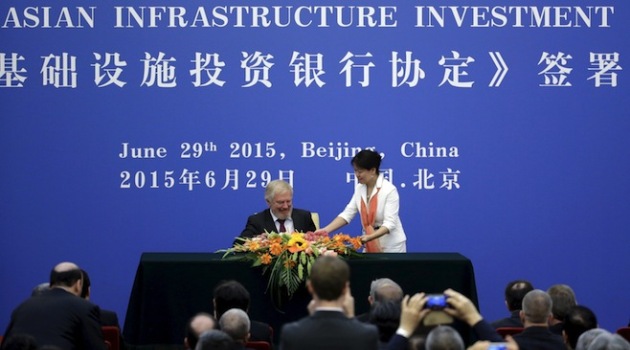 Russia's delegate prepares to sign the articles of agreement of the Asian Infrastructure Investment Bank (AIIB) at the Great Hall of the People, in Beijing, June 29, 2015. China will hold a 30.34 percent stake in the Asian Infrastructure Investment Bank (AIIB), the Finance Ministry said on Monday, making Beijing the largest shareholder in a bank that is expected to project the country's growing influence. REUTERS/Jason Lee